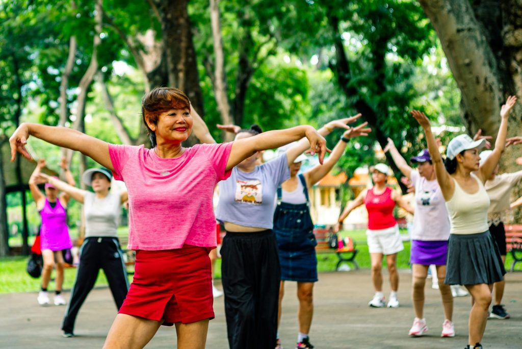 Filipino seniors doing community zumba at a barangay gym